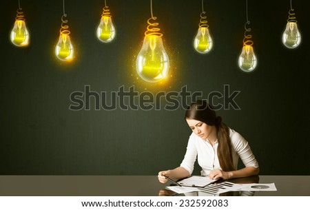 Businesswoman sitting at the black table with idea bulbs on the background