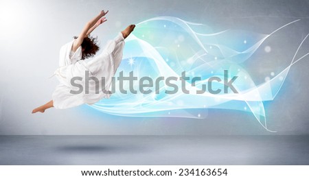 Cute teenager jumping with abstract blue scarf around her concept on background