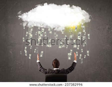 Business man in suit looking at cloud with falling money and sun