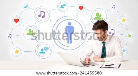 Businessman sitting at white table with social media connection background