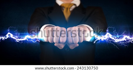 Business man holding electricity light bolt in his hands concept