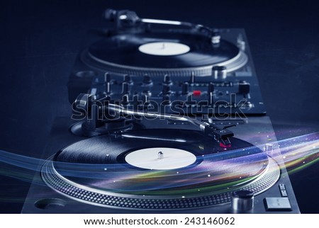 Music player playing vinyl music with colourful abstract lines concept on background