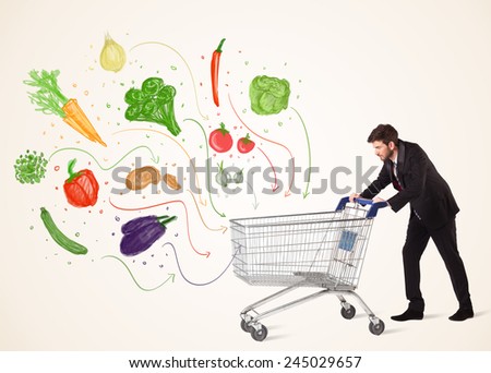 Businessman pushing a shopping cart and healthy vegetables coming out of it