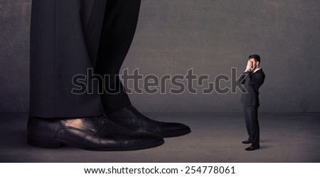 Huge legs with small businessman standing in front concept on background
