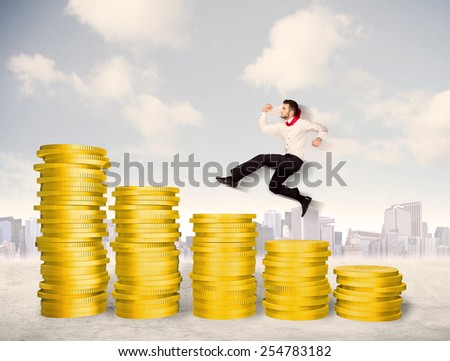Successful business man jumping up on gold coin money concept