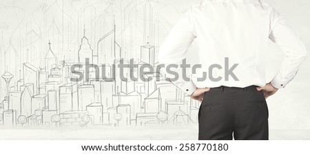 Businessman from the back in front of a drawn city view