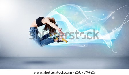 Cute teenager jumping with abstract blue scarf around her concept on background
