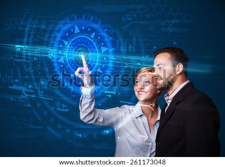 Tech couple pressing high technology control panel screen concept