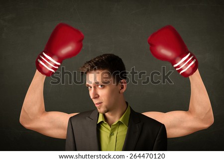 Handsome businessman with strong and muscled boxer arms concept
