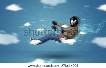 Funny racedriver young man driving between clouds concept on blue background