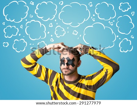 Funny person with taped mouth and hand drawn clouds around head