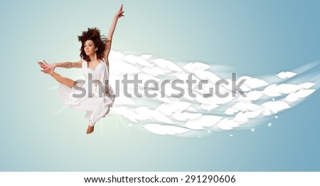 Healthy young woman jumping with feathers around her concept on bright background