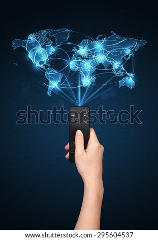 Glowing social network  world map coming out of a remote control