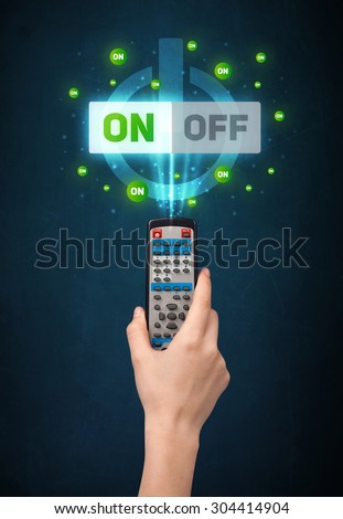 Hand holding a remote control, on-off signal coming out of it