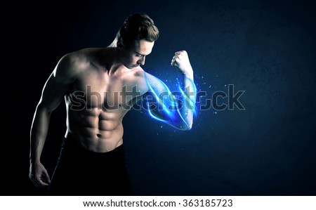 Fit athlete lifting weight with blue muscle light concept on background