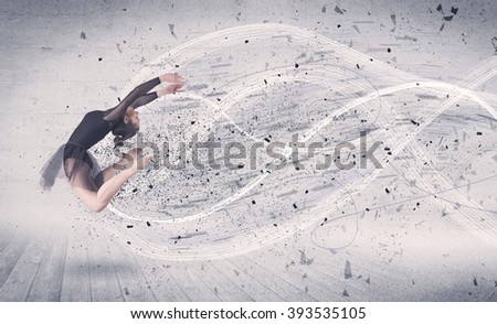 Performance ballet dancer jumping with energy explosion grungy particles concept on background