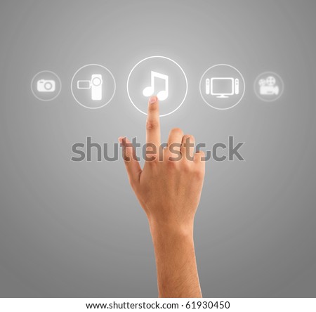 stock photo hand choosing music note symbol from media icons