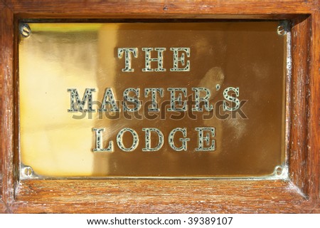 Metal plaque on the door of the Masterâ??s Lodge in Cambridge University