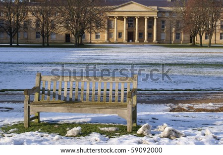 A bench on the lawn in Downing College Cambridge University
