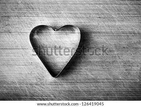 Love concept,  metal heart on grunge background, black and white