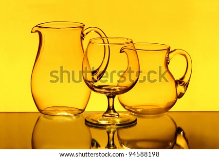 Creative composition with two wineglasses on the mirror