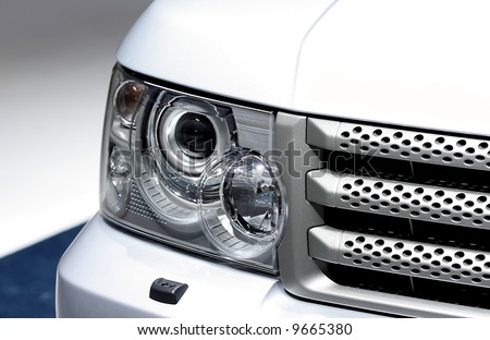 Head lamp of white sport utility vehicle