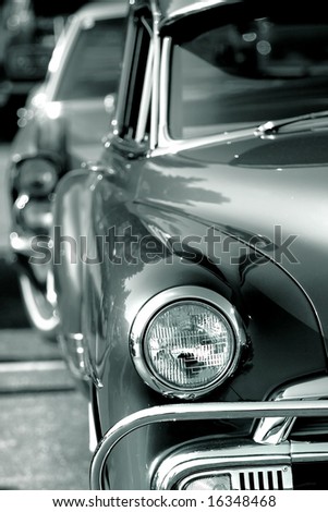 stock photo Close up shot of classic cars front passenger end in black and