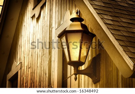 Smoke lamp mounted at the door entrance of old home