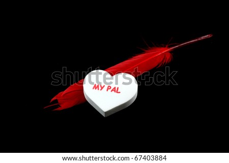 White color heart with Pal text and with red feather