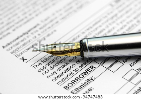 Concept of signing loan agreement with shiny pen