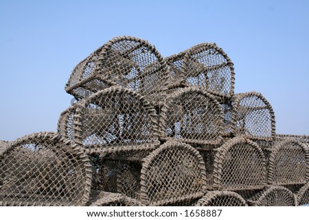 After being used to catch lobsters the pots are piled upon the harbour waiting to go out with the next fishing trip