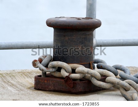 Boat is chained to the mooring cleat to secure it from drifting away 