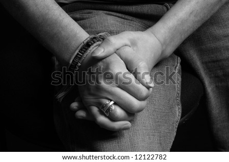 stock photo : Man clasping his hands together in black and white