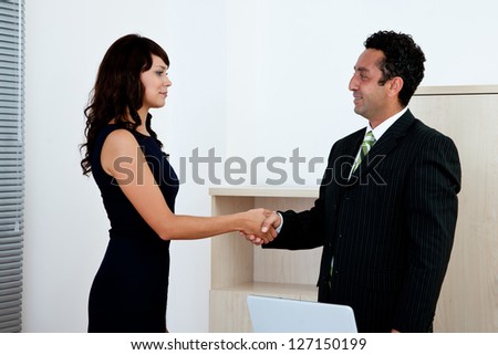 business agreement concept with businesswoman and businessman handshake