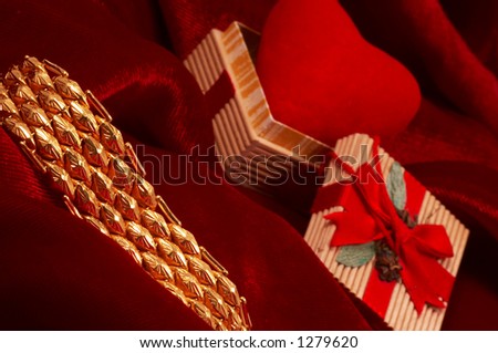 heart shape and gold on red satin