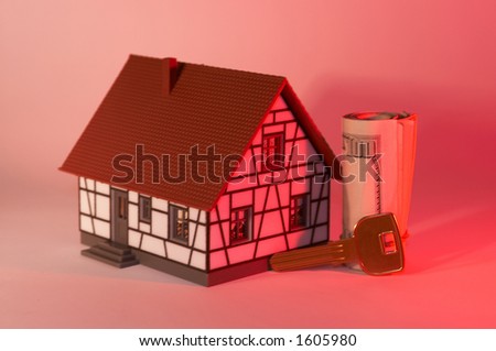 mini house with US dollars and key