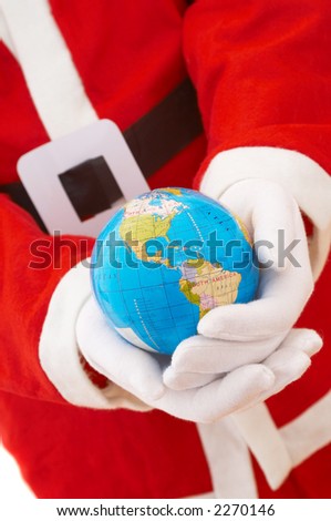 Santa Claus holding mini world, shallow dof, focus on world