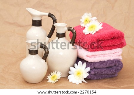 beauty concept with towels and oil, shallow dof