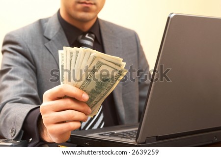 young businessman with Us dollars as a profit