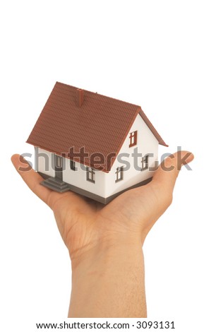 real estate concept with a hand holding mini house