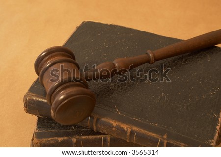 law concept with gavel and old legal books