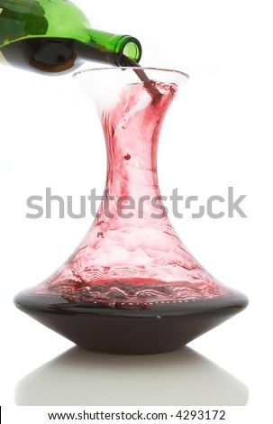 red wine pouring into carafe