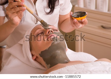 face care session at the spa center with a beautiful woman