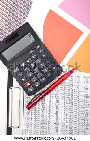 office desk with calculator and business forms