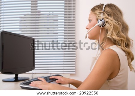customer service representative at the office with computer