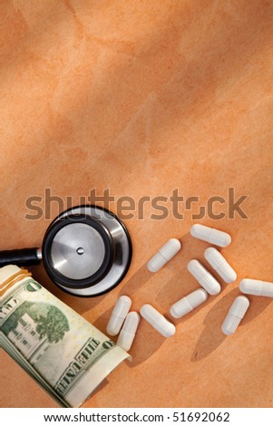 medical bill concept with stethoscope, pills and us dollar