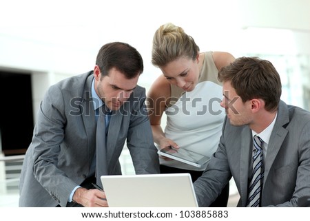 Group of business people meeting around table