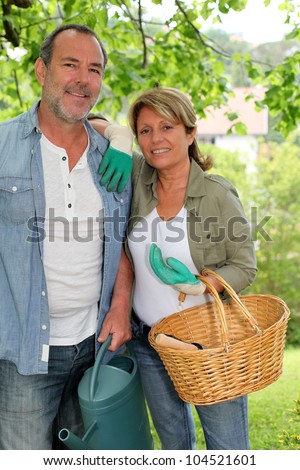 Happy senior couple gardening together