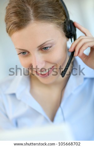 Closeup of attractive blond customer service assistant