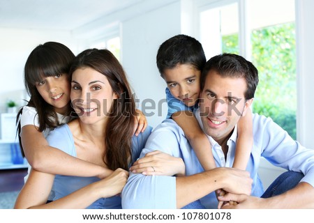 Family relaxing in sofa at home